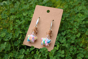 Bottle earrings with colored stars