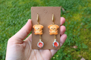 Cookie dog earrings with tea