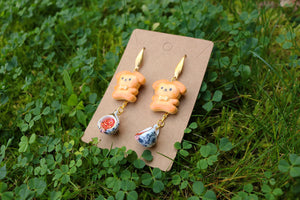 Cookie dog earrings with tea